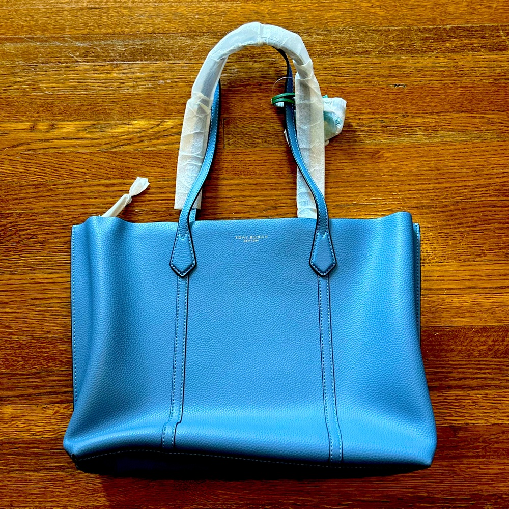 Tory Burch Pocketbook never used. Brand new.